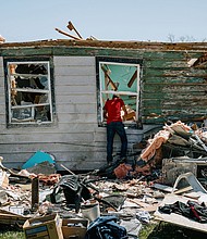 A resident looks inside a destroyed home following a tornado in Arabi, Louisiana, on March 23. In recent years, scientists have noticed an increased frequency of tornadoes in the Southeast, carving a path of lost property and lives.
Mandatory Credit:	Bryan Tarnowski/Bloomberg/Getty Images