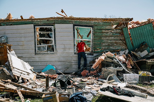 A resident looks inside a destroyed home following a tornado in Arabi, Louisiana, on March 23. In recent years, scientists have noticed an increased frequency of tornadoes in the Southeast, carving a path of lost property and lives.
Mandatory Credit:	Bryan Tarnowski/Bloomberg/Getty Images