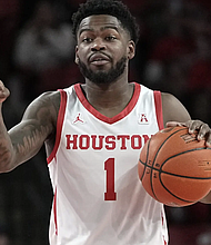 Houston’s Jamal Shead brings the ball up the court against Texas Southern during the first half of an NCAA college basketball game Wednesday, Nov. 16, 2022, in Houston. (AP Photo/David J. Phillip)