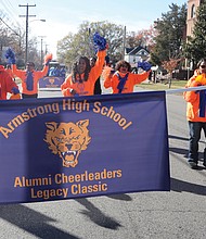 Armstrong High School alumnae cheerleaders, including retired NBC-12 anchor and Richmond native Diane Walker, center, wave to parade attendees as they make their way along Mechanicsville Turnpike during the second Armstrong-Walker Football Classic Legacy Project Parade last Saturday.