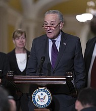 Senate Majority Leader Chuck Schumer, D-N.Y., joined from left by Sen. Jack Reed, D-R.I., chairman of the Senate Armed Services Committee, Sen. Tammy Baldwin, D-Wis., and Sen. Jon Tester, D-Mont., speaks to reporters Tuesday before a vote on legislation to protect same-sex and interracial marriages, at the Capitol.