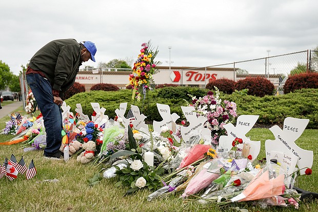 Tops supermarket shooter pleads guilty on Monday. Pictured is a memorial site outside the Tops supermarket in Buffalo, New York, on May 20.
Mandatory Credit:	Lindsay DeDario/Reuters