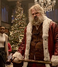 'Violent Night' delivers the goods by putting Santa Claus in 'Die Hard' mode. Alexis Louder and David Harbour are pictured here in the action-comedy.
Mandatory Credit:	Allen Fraser/Universal Pictures