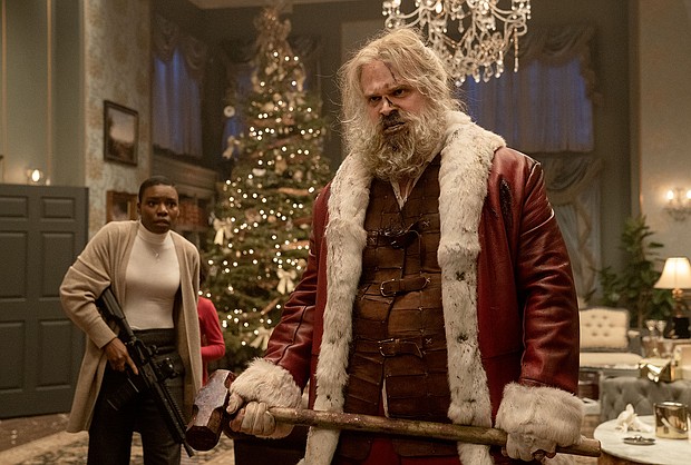 'Violent Night' delivers the goods by putting Santa Claus in 'Die Hard' mode. Alexis Louder and David Harbour are pictured here in the action-comedy.
Mandatory Credit:	Allen Fraser/Universal Pictures