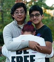 Clara, center, embraces her sons Daniel and Benjamin.
Mandatory Credit:	Elijah Nouvelage for CNN