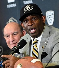 Deion Sanders speaks after being introduced Sunday as the new head football coach at the University of Colorado during a news conference.