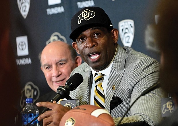 Deion Sanders speaks after being introduced Sunday as the new head football coach at the University of Colorado during a news conference.