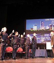 The 12 recruits from the 125th Basic Recruit Class are commissioned by R.J. Warren, deputy city clerk for the City of Richmond, as new police officers Thursday, Dec. 1, at the Virginia Museum of Fine Arts. The ceremony followed nearly a year of intense training for the recruits. The new members of RPD represent diverse backgrounds: A new mother who completed training after giving birth to her son, an Iraqi who has past experience from a war-torn country, and a woman who was elected the group’s president.