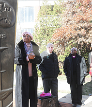 Virginia State Delegate Delores McQuinn discusses the history of the Richmond Reconciliation Statue in Richmond’s Shockoe Bottom with the Rev. Benjamin Campbell on Dec. 2. Del. McEachin and Rev. Campbell are former Richmond Slave Trail commissioners. Joining them were The Most. Rev. Michael Curry, presiding bishop of The Episcopal Church, and the Rt. Rev. E. Mark Stevenson, far right, who recently was ordained and consecrated as the 14th bishop of the 237-year-old Episcopal Diocese of Virginia.