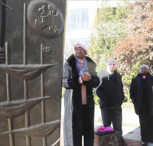 Virginia State Delegate Delores McQuinn discusses the history of the Richmond Reconciliation Statue in Richmond’s Shockoe Bottom with the Rev. Benjamin Campbell on Dec. 2. Del. McEachin and Rev. Campbell are former Richmond Slave Trail commissioners. Joining them were The Most. Rev. Michael Curry, presiding bishop of The Episcopal Church, and the Rt. Rev. E. Mark Stevenson, far right, who recently was ordained and consecrated as the 14th bishop of the 237-year-old Episcopal Diocese of Virginia.