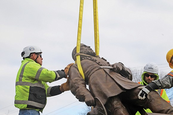 A statue commemorating the death of Confederate Gen. Ambrose Powell (A.P.) Hill was removed on Monday, from Hermitage Road and ...