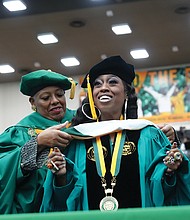 Hip-hop artist Missy Elliott delivered the keynote address to some 400 graduating students at Norfolk State University on Dec. 10. The Portsmouth-born singer and songwriter was awarded the Presidential Commencement Medallion and an honorary doctorate of humanities. She is shown with Dr. Javaune Adams-Gaston, president of Norfolk State University.