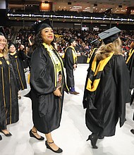 Alicia Jones of Suffolk, right center, was among the 2,450 excited graduates at VCU’s December commencement.
