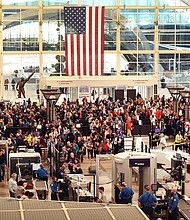 Travelers at Denver International Airport on November 22. Thanksgiving kicks off the annual air travel scramble.
Mandatory Credit:	Scott Olson/Getty Images