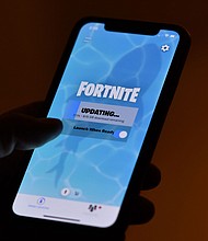 Epic Games, maker of the hit video game "Fortnite," has agreed to pay a total of $520 million to settle US government allegations that it misled millions of players, including children and teens, into making unintended purchases and that it violated a landmark federal children's privacy law.
Mandatory Credit:	Chris Delmas/AFP/Getty Images