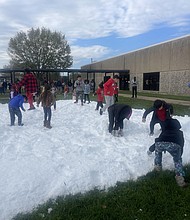 Kids enjoying freshly-made real snow in Houston at Jimmy The Jeweler’s 8th Annual Iced Out Christmas Giveaway