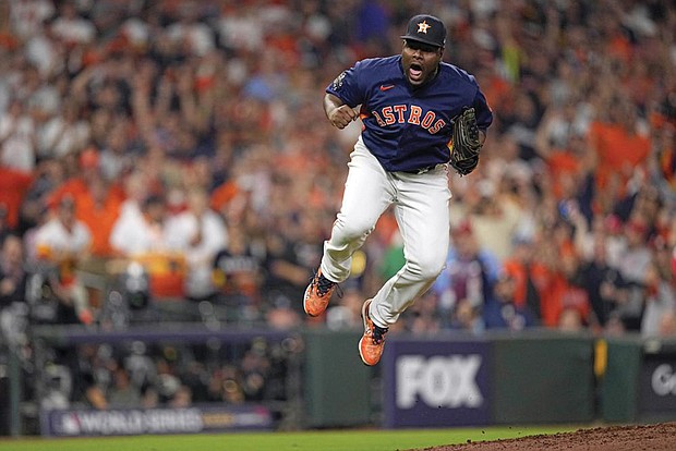 Houston Astros relief pitcher Hector Neris celebrates the last out in the top of the seventh inning in Game 6 of baseball’s World Series between the Houston Astros and the Philadelphia Phillies on Saturday, Nov. 5 in Houston.