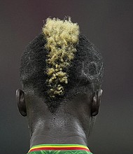 Mali’s Falaye Sacko stands on the pitch during the African Cup of Nations 2022 group F soccer match between Mali and Mauritania at the Japoma Stadium in Douala, Cameroon, Thursday, Jan. 20.