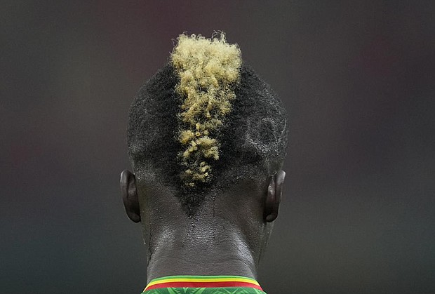 Mali’s Falaye Sacko stands on the pitch during the African Cup of Nations 2022 group F soccer match between Mali and Mauritania at the Japoma Stadium in Douala, Cameroon, Thursday, Jan. 20.