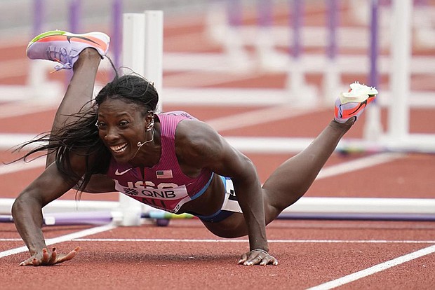 Nia Ali, of the United States, falls while competing in a heat in the women’s 100-meter hurdles at the World Athletics Championships on Saturday, July 23, in Eugene, Ore.