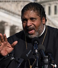 The Rev. William Barber II of the Poor People’s Campaign talks about the need for the “Build Back Better” plan, voting rights, health care, immigrant rights and action on climate change, during a news conference in Oct. 2021 on Capitol Hill in Washington.