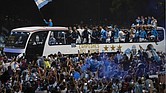 Argentina soccer fans crowd a highway for a homecoming parade for the players who won the World Cup title, in Buenos Aires, Argentina, Tuesday, Dec. 20,