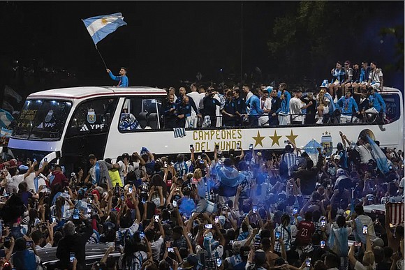 A parade to celebrate the Argentine World Cup champions was abruptly cut short Tuesday as millions of people poured onto ...