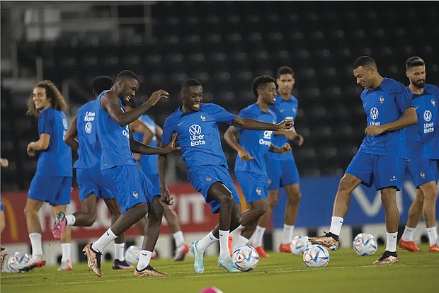 From left, France’s Matteo Guendouzi, Marcus Thuram, Randal Kolo Muani, Kingsley Coman, Raphael Varane, Kylian Mbappe and Olivier Giroud practice Dec. 8 during a training session at the Jassim Bin Hamad stadium in Doha, Qatar. France played England during their World Cup quarter-final soccer match Dec. 10.