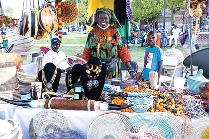 Awas, owner of Awa’s African Art, displays her baskets, jewelry, furniture and other wares during Elegba Folklore Society’s 31st Annual Down Home Family Reunion, A Celebration of African American Folklife on Aug. 20 at Abner Clay Park.
