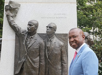 Virginia House Minority Leader Don L. Scott. Jr. stands next to the Virginia Civil Rights Monument at the Virginia State Capitol on June 21.