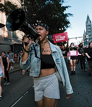 Activist Kam of Catch the Fire helped organize and lead hundreds of men and women during a rally in response to the U.S. Supreme Court’s decision to overturn Roe v. Wade on June 24.