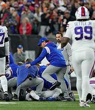 Damar Hamlin is examined after collapsing on the field in the first quarter of Monday night's game between the Buffalo Bills and Cincinnati Bengals.
Mandatory Credit:	Jeff Dean/AP