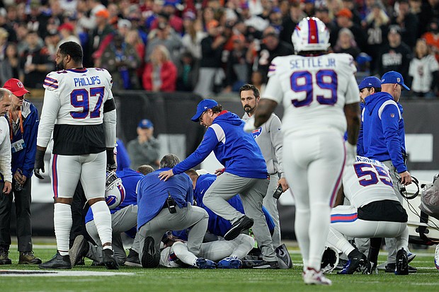 Damar Hamlin is examined after collapsing on the field in the first quarter of Monday night's game between the Buffalo Bills and Cincinnati Bengals.
Mandatory Credit:	Jeff Dean/AP