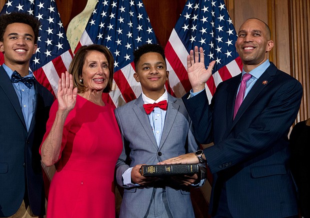 House Speaker Nancy Pelosi administers the House oath of office to Rep. Hakeem Jeffries, during a ceremonial swearing-in on Capitol Hill in Washington in January 2019.
Mandatory Credit:	Jose Luis Magana/AP