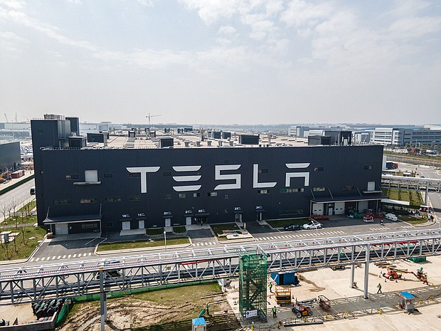 Tesla's shares plunge further on weaker than expected sales. Pictured is the Tesla Gigafactory Shanghai on March 29, 2021 in Shanghai, China.
Mandatory Credit:	Xiaolu Chu/Getty Images