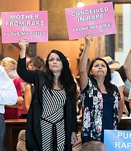 Protesters hold signs inside the South Carolina Statehouse as lawmakers debate an abortion ban in August, 2022.
Mandatory Credit:	Sean Rayford/SOPA Images/LightRocket via Getty Images
