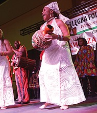 Janine Belle, right, Elegba’s founder and artistic director, and her daughter, Imani Belle, lead the opening to the Kwanzaa Festival.