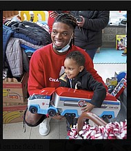 Pittsburgh NCAA college football defensive back Damar Hamlin poses for a photo with Bryce Williams, 3, of Mckees Rocks, Pa., after the youngster picked out a toy during Hamlin’s Chasing M’s Foundation community toy drive at kelly and Nina’s Daycare Center, Tuesday, Dec. 22, 2020, in Mckees Rocks, Pa. Hamlin wanted to raise $2,500 online to buy toys for needy kids. It took about two years. Then came Monday, Jan. 2, 2023, when the Buffalo Bills safety was critically injured during a game against the Cincinnati Bengals. He instantly became one of the biggest stories in sports, and thousands of people found his GoFundMe page. The result: Roughly $3.7 million donated in the first 12 hours.