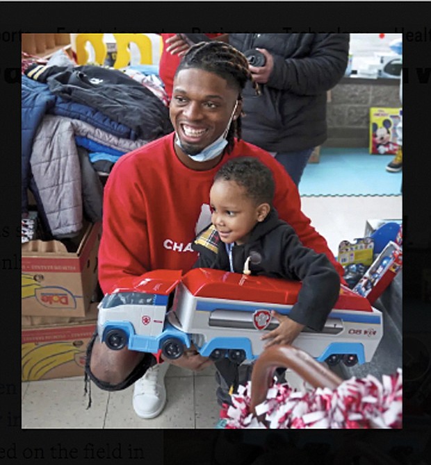 Pittsburgh NCAA college football defensive back Damar Hamlin poses for a photo with Bryce Williams, 3, of Mckees Rocks, Pa., after the youngster picked out a toy during Hamlin’s Chasing M’s Foundation community toy drive at kelly and Nina’s Daycare Center, Tuesday, Dec. 22, 2020, in Mckees Rocks, Pa. Hamlin wanted to raise $2,500 online to buy toys for needy kids. It took about two years. Then came Monday, Jan. 2, 2023, when the Buffalo Bills safety was critically injured during a game against the Cincinnati Bengals. He instantly became one of the biggest stories in sports, and thousands of people found his GoFundMe page. The result: Roughly $3.7 million donated in the first 12 hours.