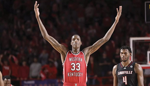 At 7-5, Western Kentucky University’s center Jamarion Sharp is the tallest player in college basketball; No. 4 for Louisville is 6-11 Roosevelt Wheeler from John Marshall High.