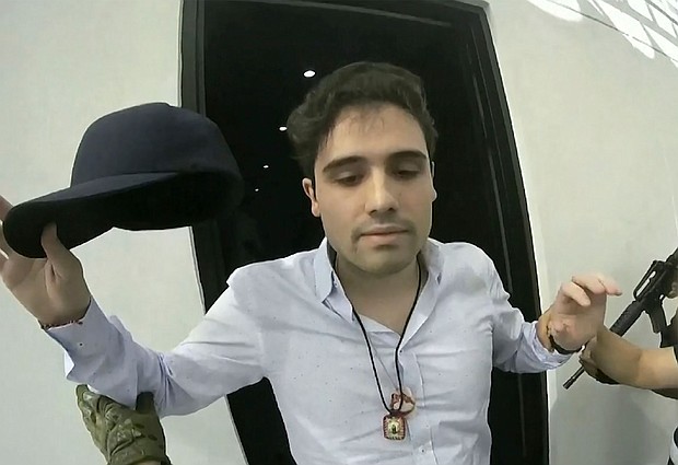File photo shows Ovidio Guzmán being arrested by Mexican authorities in October 2019.
Mandatory Credit:	Cepropie/AP