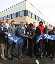 Joey Trapani, center, COO of Bon Secours Community Hospital, conducts the official ribbon-cutting with Cynthia Newbille, City Council representative for the 7th District in Richmond’s East End. They are joined by others from the community, elected officials and surrounding health care systems employees.