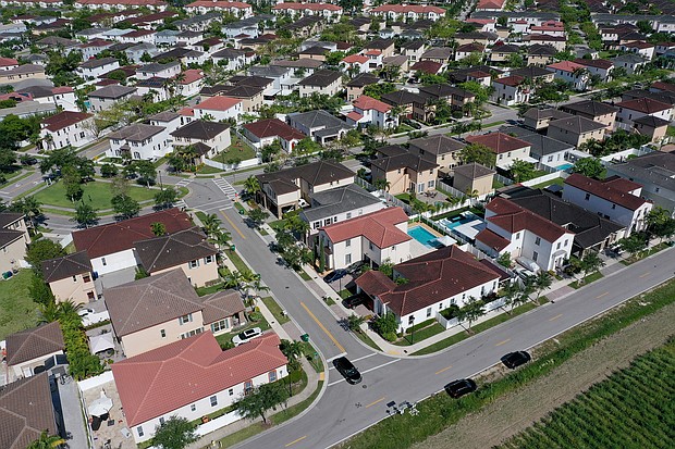 Mortgage rates inched down last week, after a slight increase the week before. Pictured is a residential neighborhood on May 10, 2022 in Miami, Florida.
Mandatory Credit:	Joe Raedle/Getty Images