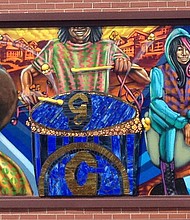 Artist Rahmaan Statik created the mural at Garrett’s Popcorn, located 757 E. 87th St. Photo provided by Rahmaan Statik.