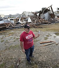 John Liparito surveys storm damage Tuesday in Pasadena, Texas.
Mandatory Credit:	David J. Phillip/AP