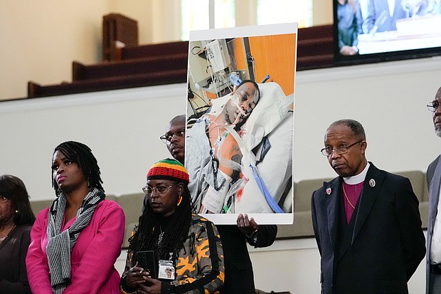Family members and supporters hold a photograph of Tyre Nichols at a news conference in Memphis, Tennessee on January 23.
Mandatory Credit:	Gerald Herbert/AP