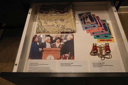 Pull-out drawers that showcase former Virginia governors include a photograph of former Gov.
L. Douglas Wilder’s inauguration with his daughters Lynn and Loren Wilder, and son Larry Wilder joining him for the historic occasion.