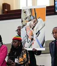 Video of the violent arrest of Tyre Nichols, is expected to be difficult to watch but it may also be hard to avoid. Family members and supporters hold a photograph of Nichols, who died after being beaten by Memphis police officers.
Mandatory Credit:	Gerald Herbert/AP
