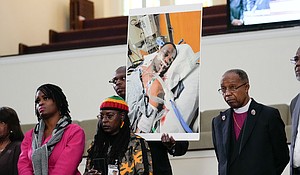 Video of the violent arrest of Tyre Nichols, is expected to be difficult to watch but it may also be hard to avoid. Family members and supporters hold a photograph of Nichols, who died after being beaten by Memphis police officers.
Mandatory Credit:	Gerald Herbert/AP