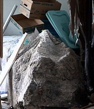 A 65-year resident of Palolo, Hawaii, Caroline Sasaki said she has never heard of a boulder falling from the west side of the valley, until one plunged into her own home over the weekend.
Mandatory Credit:	KITV